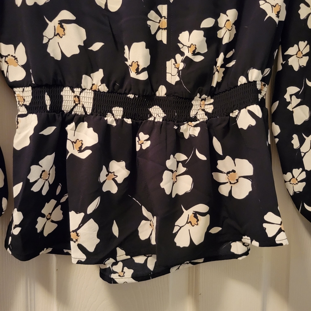 Beautiful black and white floral blouse with peplum.